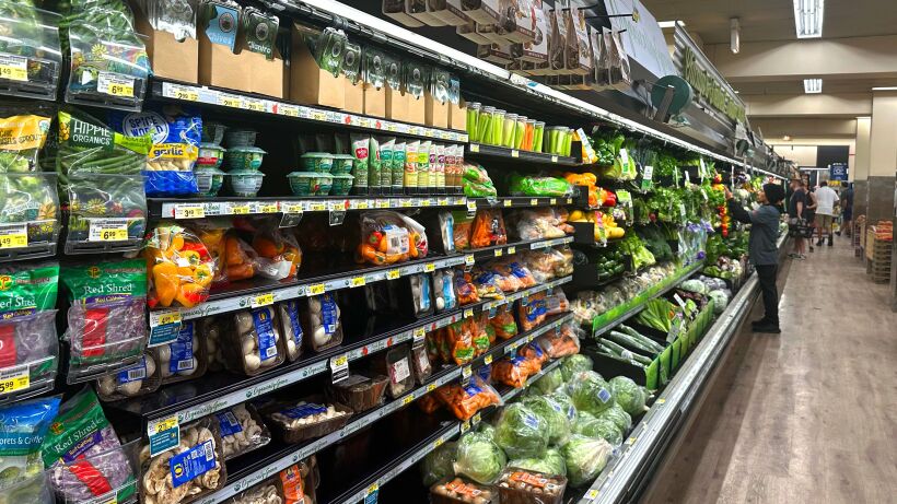 an image of a isle in a grocery store featuring fresh produce